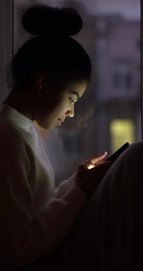 Connected. Side view of young mixed race woman using smartphone, scrolling the Stock Footage 146203766
