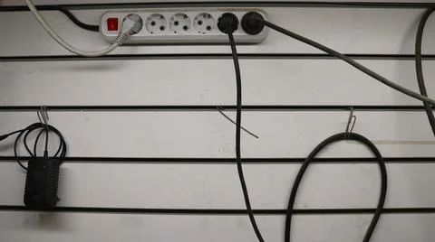 Connected sockets in a network adapter on a white panel Stock Photos