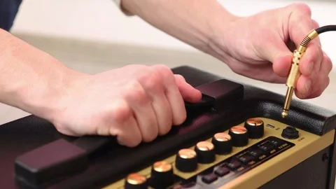 Connecting audio cable to amplifier Stock Footage 265238142