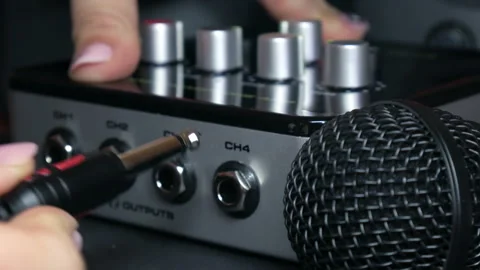Connecting Audio Cables to Professional Sound Mixer and Microphone, Close-Up Stock Footage 327467922