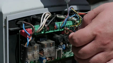 Connecting the automatic garage gate mechanism with remote controller Stock Footage 201271725
