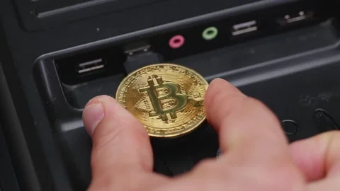 Connecting BTC to your computer. Activating bitcoin coin by flashing USB to.. Stock Footage 251043466