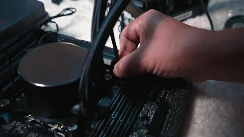 Connecting cable to header near water cooling system Stock Footage 324593156