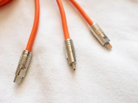 Connecting cables audio technology components a white surface close-up pers.. Stock Photos