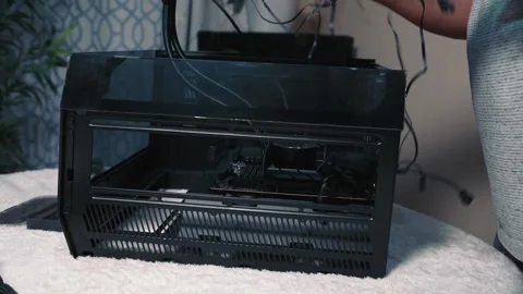 Connecting cables to motherboard during computer build process Stock Footage 325802755