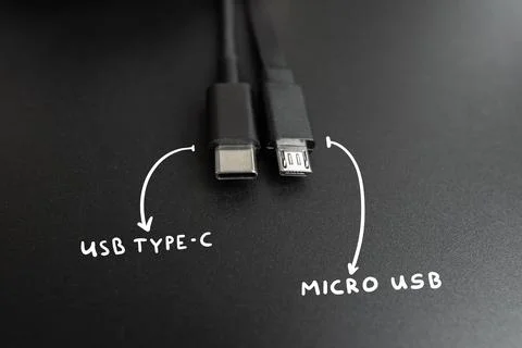 Connecting cables usb type C and micro wires. Popular and old technological s Stock Photos