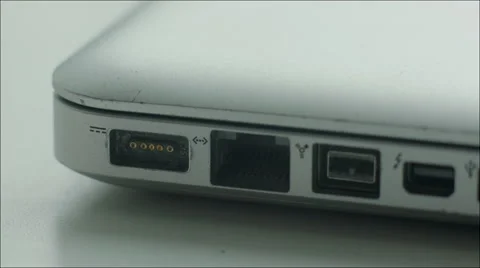 Connecting Charger with Laptop Stock Footage 60383855