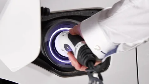 Connecting the Charger Plug of an Electric Hybrid Car Stock Footage