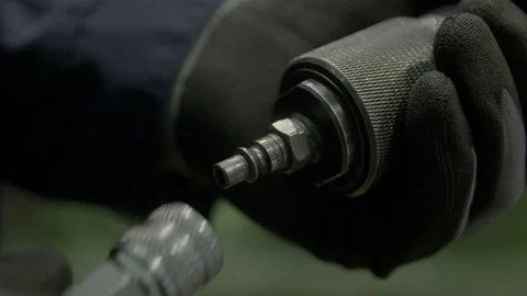 Connecting a compressor hose Stock Footage 69772079