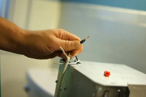 Connecting electrical cables. Stock Photos