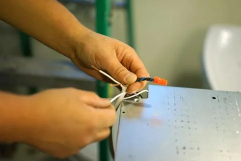 Connecting electrical cables. Stock Photos