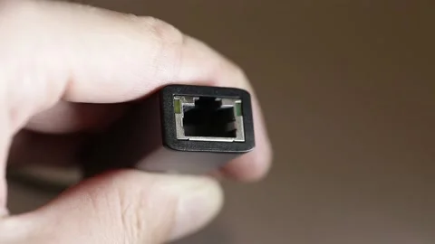 Connecting the ethertner cable to the adapter close-up Stock Footage 155325640