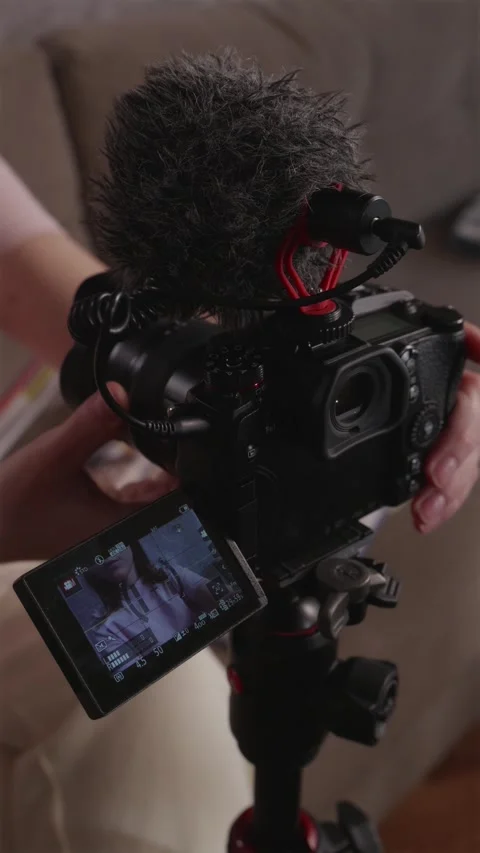 Connecting external microphone to camera for professional vlogging Stock-Footage 337451938