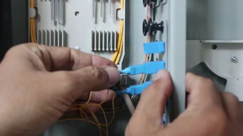 Connecting fiber optic cables to internet network ports. Connecting the internet Stock Footage 289269539