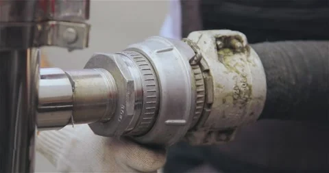 Connecting a fire hose close-up.The fireman connects the fire hose. Stock Footage 266243015