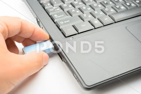 Connecting of flashdrive to the notebook Stock Photos