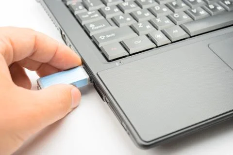 Connecting of flashdrive to the notebook Stock Photos