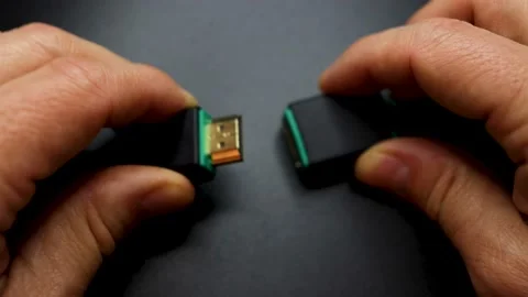 Connecting an HDMI Cable isolated on gray background Stock Footage 156750378