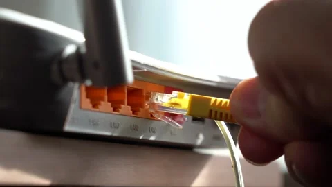Connecting the Internet Cable from the Router Stock Footage 150492917