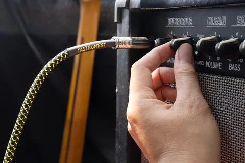 Connecting Jack Audio into the Guitar Amplifier Outdoors.	 Stock Photos