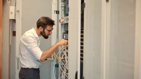 Connecting Lan Cable To Mainframe.IT Engineer Patching Network Video stock 157558175