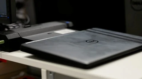 Connecting a laptop to its docking station, 2 monitors setup Stock Footage 122053150