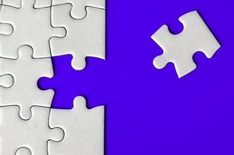 Connecting missing white jigsaw puzzle symbolizes partnership and unity on .. Stock Photos