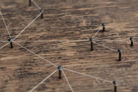 Connecting networks concept - network connected with yarn white on Plank wood Stock Photos