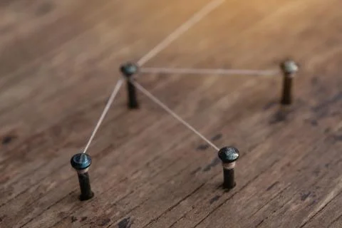Connecting networks concept - network connected with yarn white on Plank wood Stock Photos