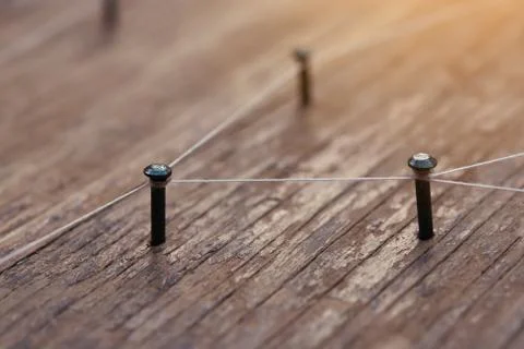 Connecting networks concept - network connected with yarn white on Plank wood Foto stock