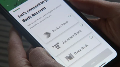 Connecting phone to bank reverse 库存影片 100799255