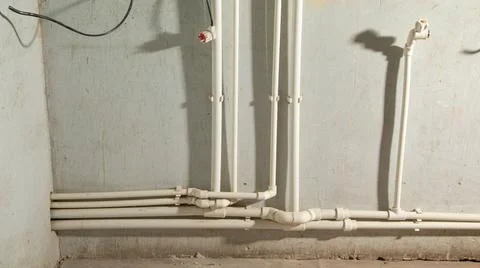 Connecting plastic pipe. Installing water heating radiator Stock Photos