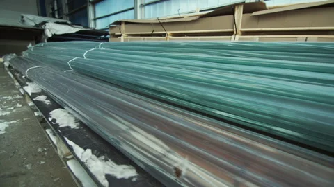 Connecting polycarbonate profiles lie on pallet in warehouse Stock Footage 229721376