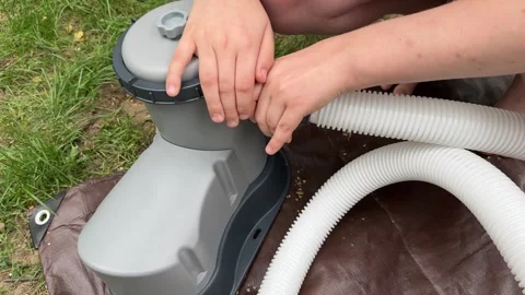 Connecting a Pool Pump to a Large Inflatable Pool Video stock 279248539