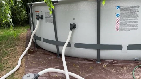 Connecting a Pool Pump to a Large Inflatable Pool Video stock 279248909