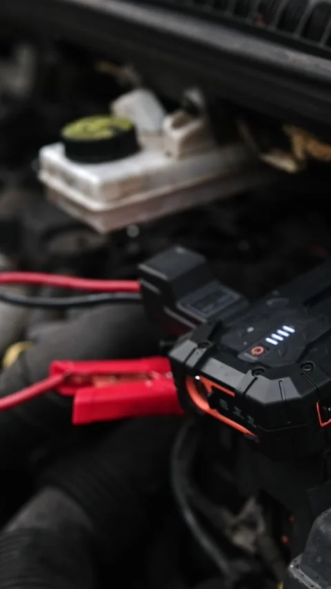 Connecting Portable Jump Starter Battery Device To Engine With Low Battery Stock Footage 338408040