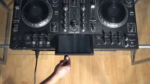 Connecting power and XLR cables to DJ mixer (above) Stock Footage 201984296