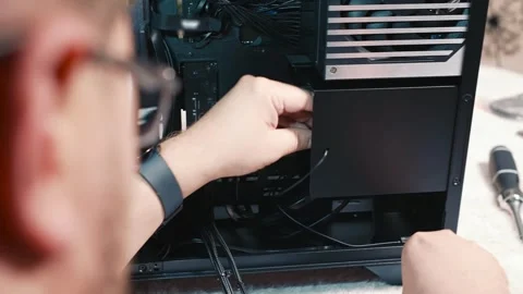Connecting power cable to computer power supply unit Stock Footage 340881537