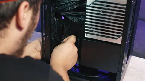Connecting power supply cables during computer cable management Stock Footage 340882901