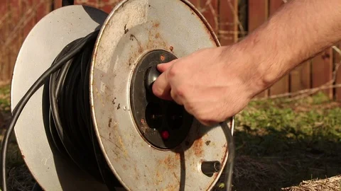 Connecting a rusty cable roller Stock Footage 98274708