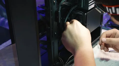 Connecting SATA cables to SSD and hard drive inside the PC case Stock Footage 328988214