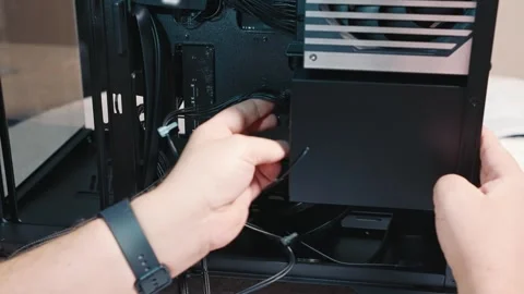 Connecting SATA power to SSD drive inside PC case Stock Footage 325810163