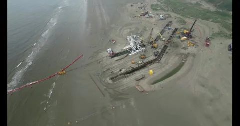 Connecting a seacable from a windpark to an onshore power hub Stock Footage 291330074