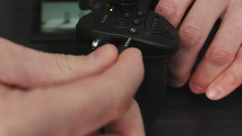 Connecting shutter release cable to mirrorless camera Stock Footage 236163243