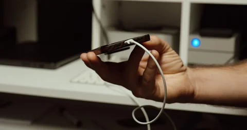 Connecting Smartphone to Computer with USB Cable – Data Transfer Close-Up Stock Footage 331956204
