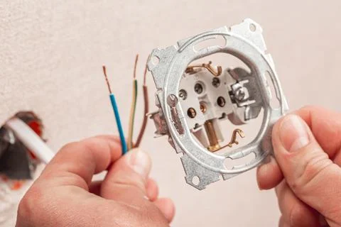 Connecting the socket in the house to the mains Stock Photos