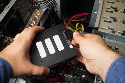 Connecting SSD drive. Stock Photos