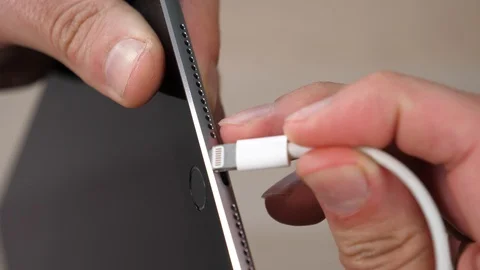 Connecting a Tablet Device To a Charging Cable Closeup Stock Footage 90014571