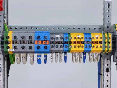 Connecting through-pass electrical terminals in the electrical panel Stock Photos