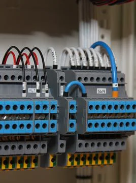 Connecting through-pass electrical terminals in the electrical panel Stock Photos